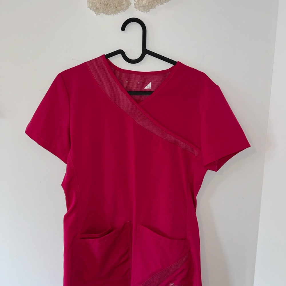 Pink two-pocket scrub top